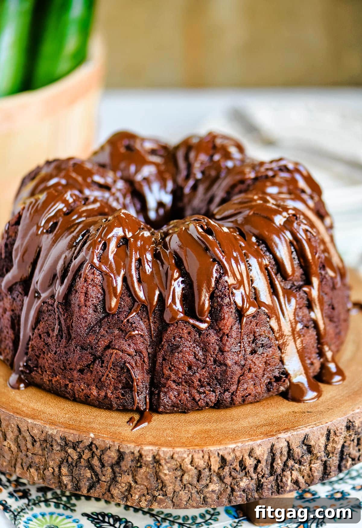 Decadent Chocolate Zucchini Cake 5 beautiful shiny chocolate glaze on top of a bundt cake.