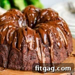 close up look at chocolate zucchini cake with chocolate glaze.