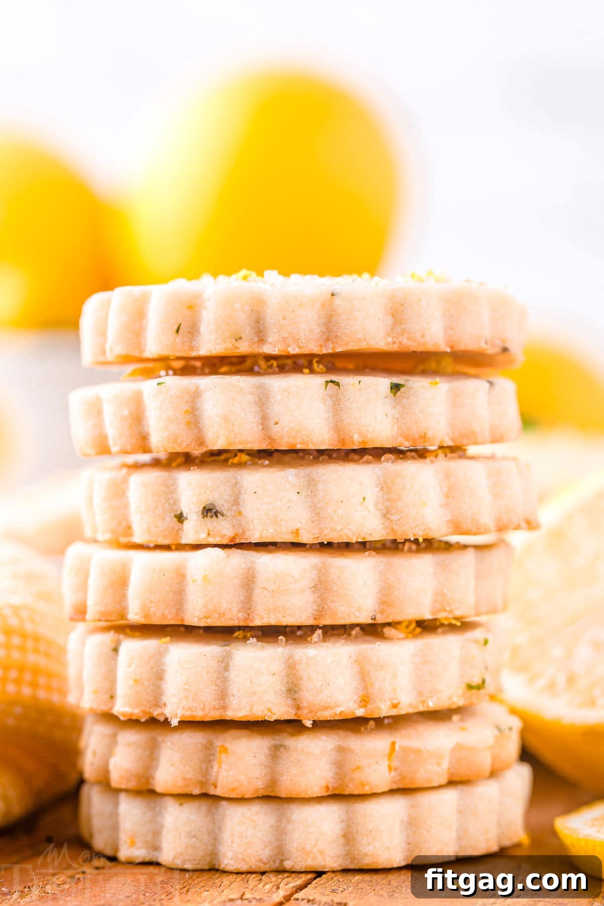 Zesty Lemon Basil Shortbread 6 A striking front view of a generously sized stack of lemon basil shortbread cookies, showcasing their golden hue and delicate texture. A vibrant, fresh presentation for a truly inviting treat.