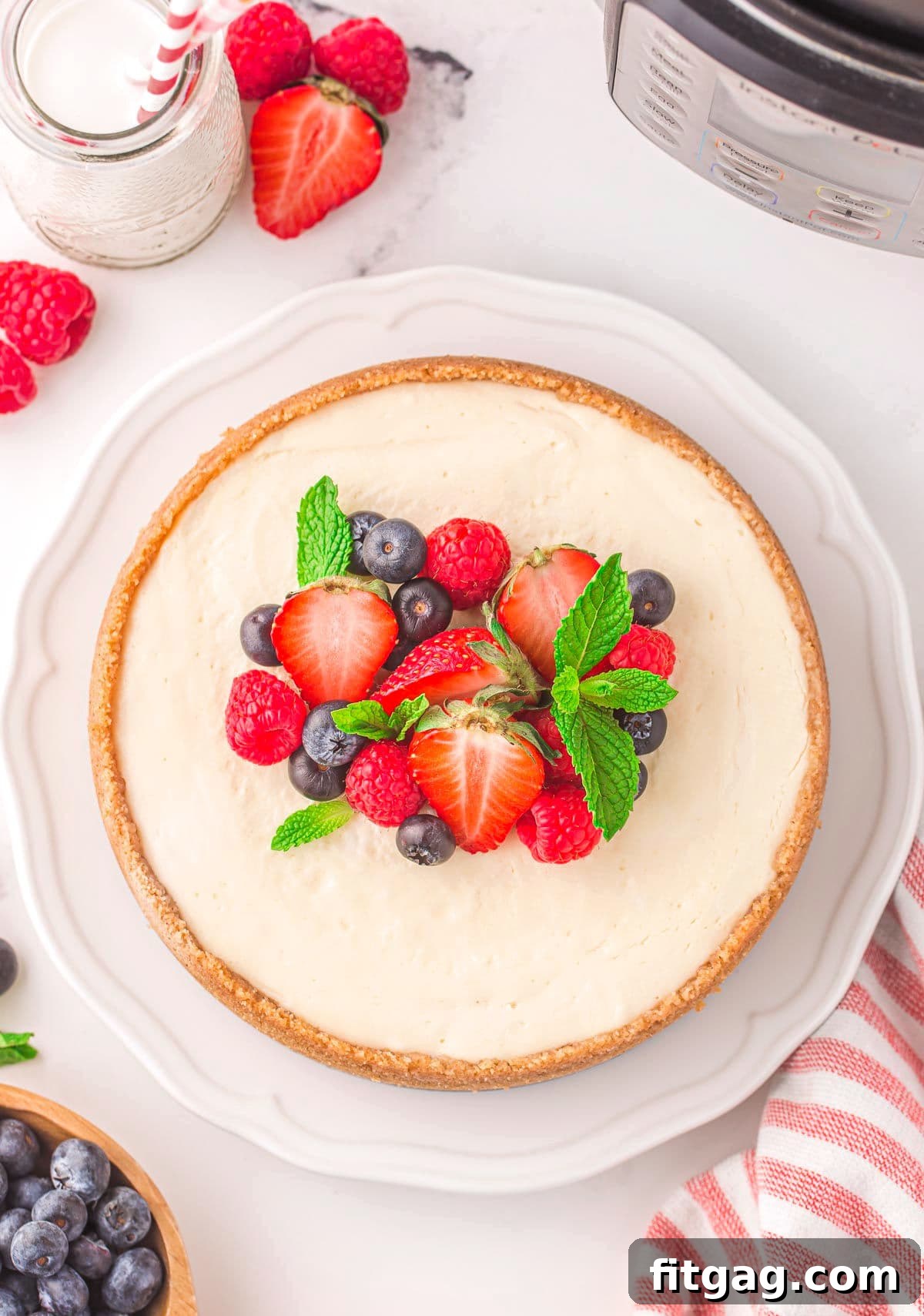 top down view of whole cheesecake topped with fresh berries.
