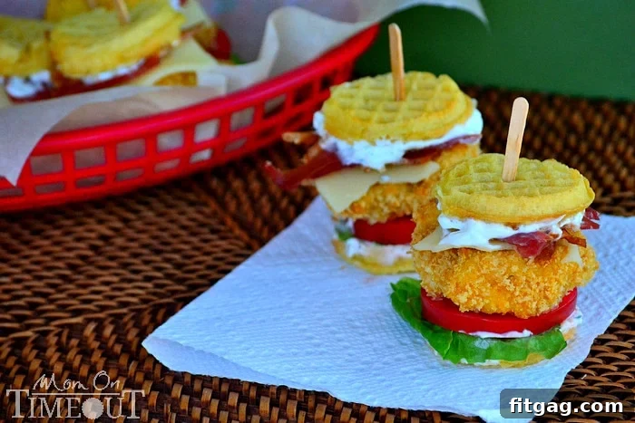 Assembled Chicken Ranch Waffle Sliders with ranch, bacon, Swiss cheese, and fresh vegetables