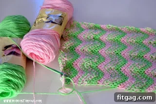 Crochet doll blanket pink and green stripe close-up
