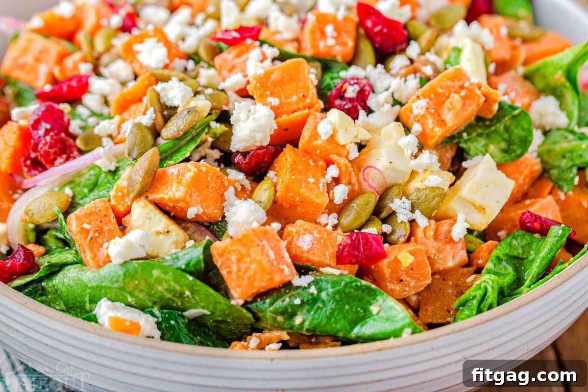 Super close-up view of the assembled sweet potato salad, highlighting the vibrant colors and appealing mix of ingredients.