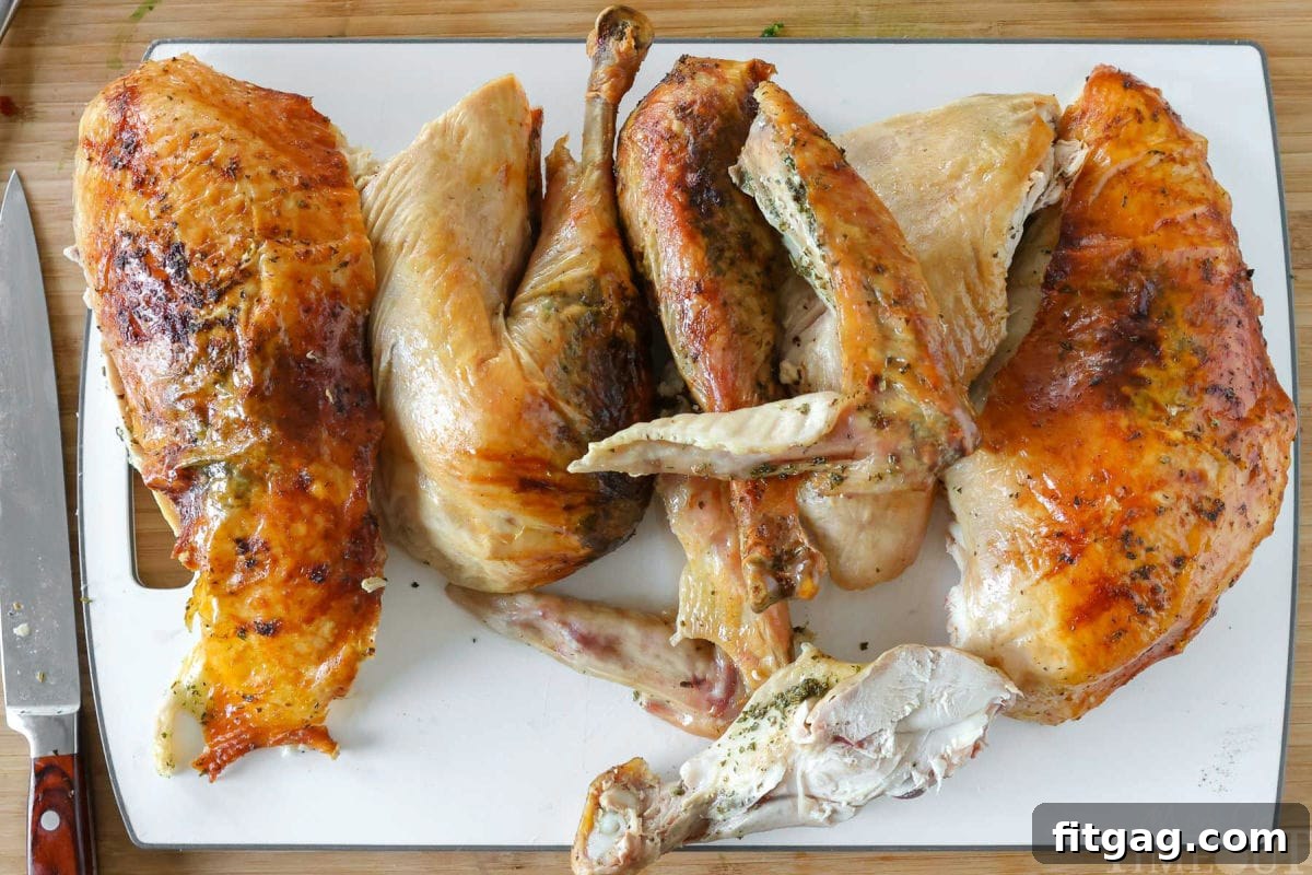 Unlock the Juiciest Thanksgiving Turkey 8 Roast turkey recipe cut into pieces ready to be plated and served.