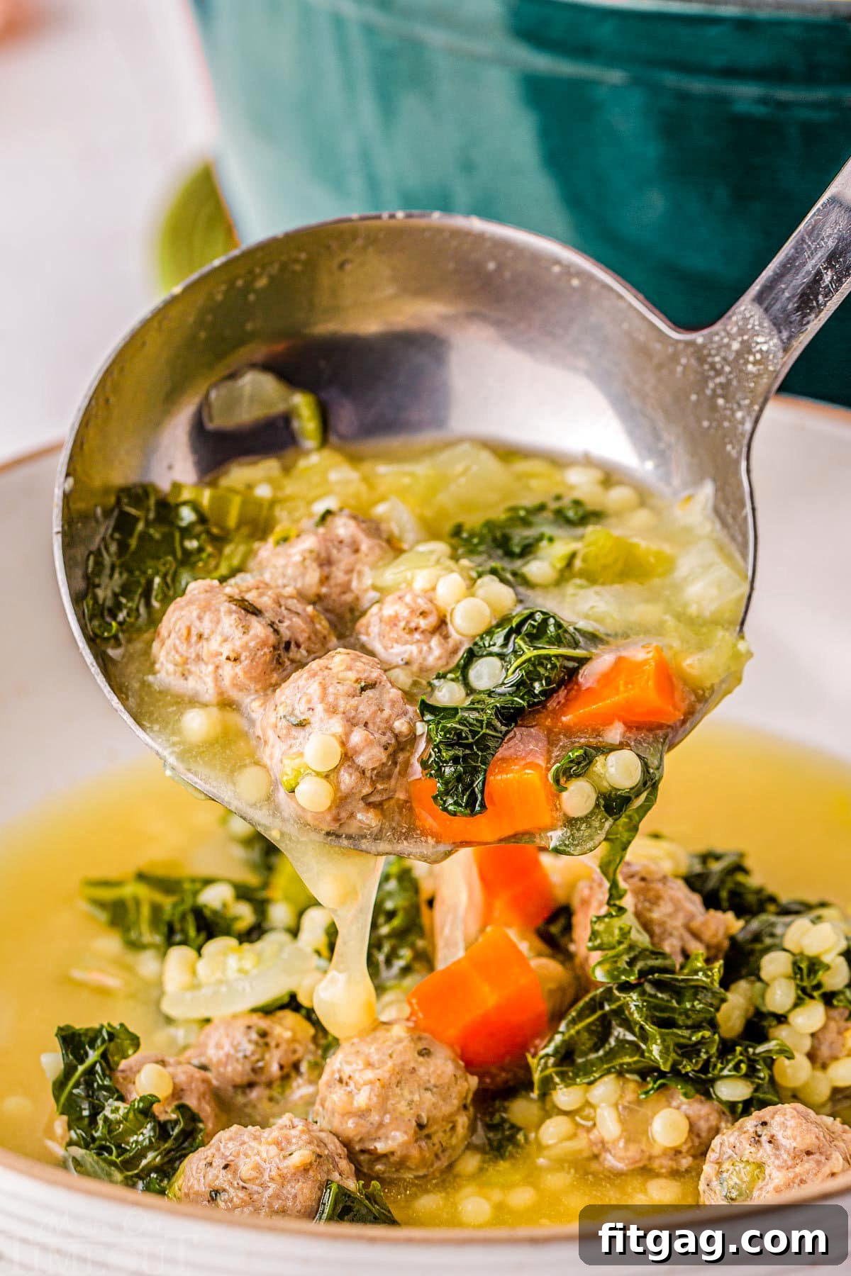 Italian Union Soup 7 Ladle of Italian Wedding Soup being ladled into a big bowl.