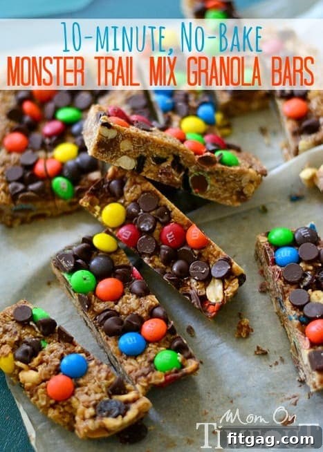Homemade No-Bake Granola Bars - Perfect for On-the-Go Snacking Stack of homemade Monster Trail Mix granola bars with M&Ms and chocolate chips