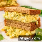 Savory Egg Salad Sensation 7 Two egg salad sandwiches stacked on top of each other, representing the final dish.