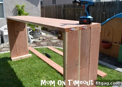 A wide shot of the large raised garden bed with three sides fully constructed.