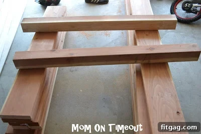 The 4x4 posts are being cut precisely with a circular saw.