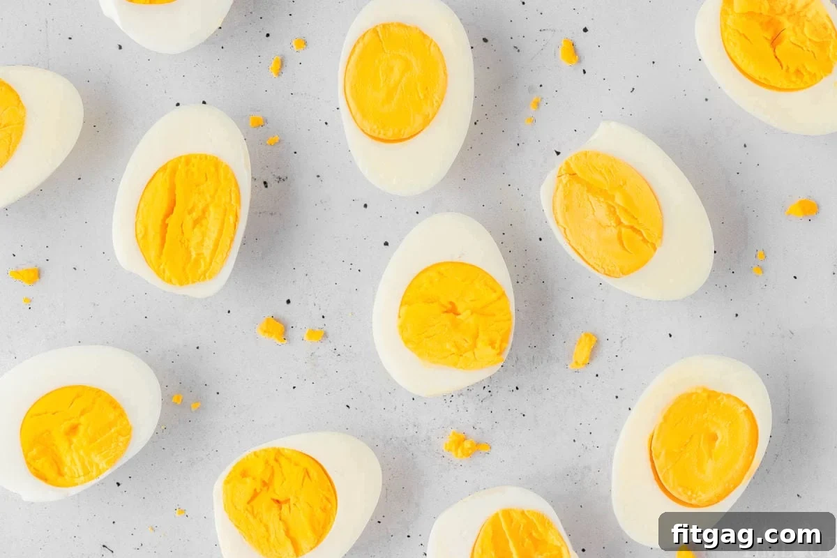 Hard boiled eggs on a light surface.