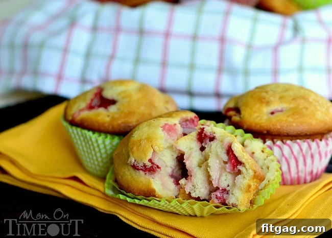 Freshly baked Strawberry and Cream Cheese Muffins on a wire rack, ready to be enjoyed