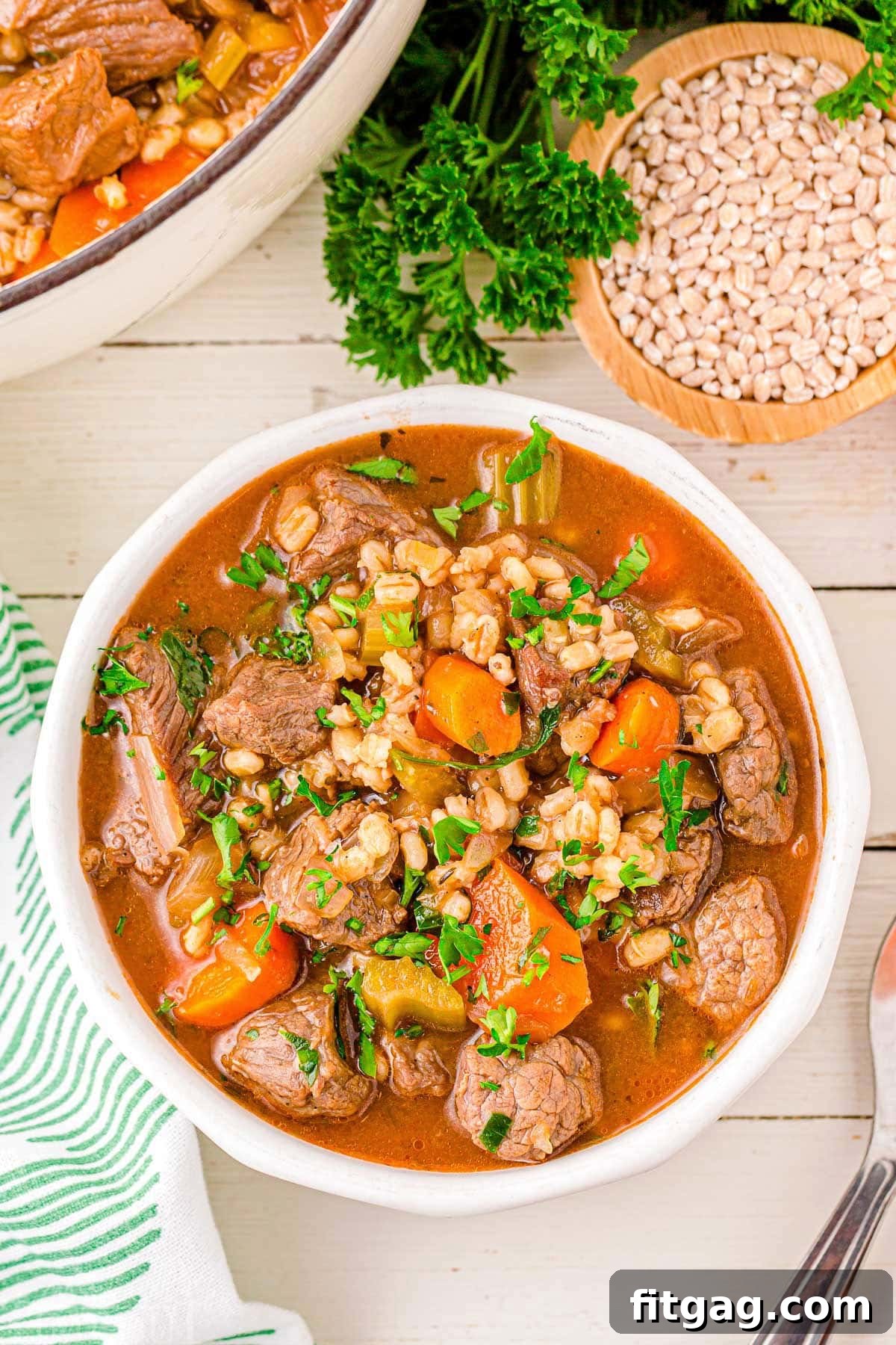 Hearty Beef and Barley Comfort Bowl 6 A top down view of a bowl of beef and barley soup.
