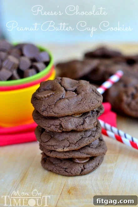 A perfectly baked Chocolate Peanut Butter Cup Cookie with Reese's minis on top