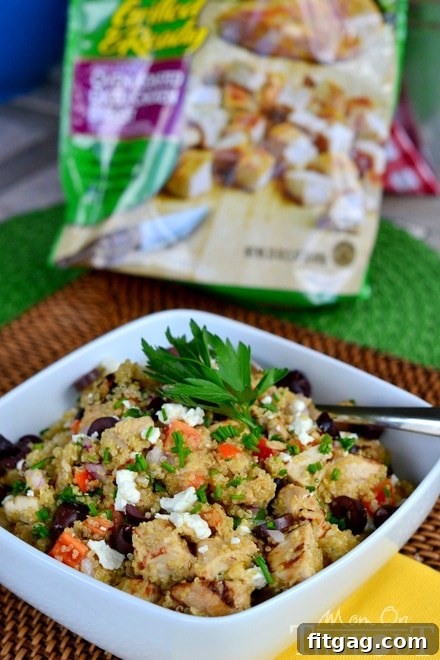 Final plated Mediterranean Chicken Quinoa Salad with a fork