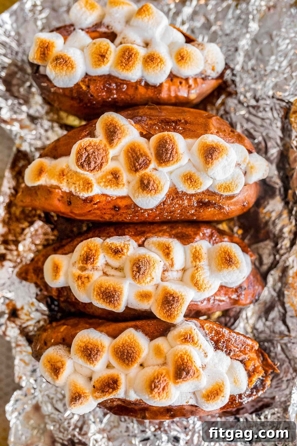Twice baked sweet potatoes on a piece of aluminum foil.