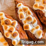 Close up shot of twice baked sweet potatoes on a piece of parchment paper.