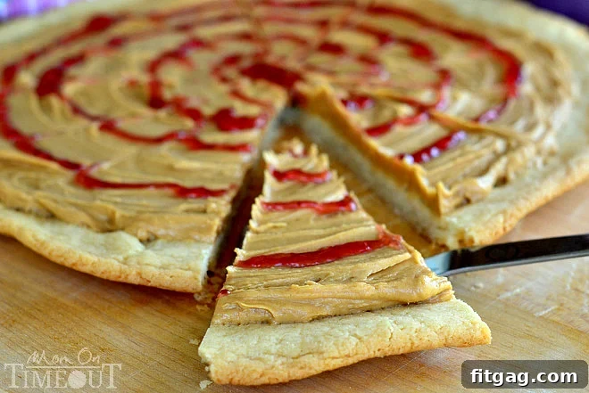 Peanut Butter and Jelly Sugar Cookie Pizza - Inspired by #Disney! from MomOnTimeout.com