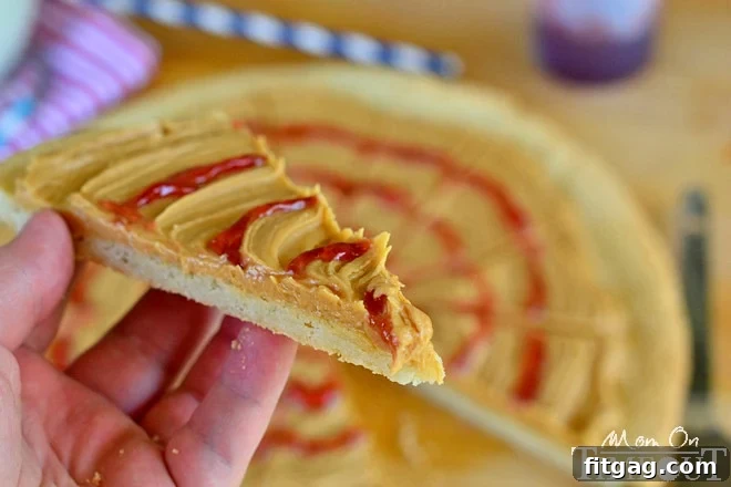 Peanut Butter and Jelly Sugar Cookie Pizza - Inspired by #Disney! from MomOnTimeout.com