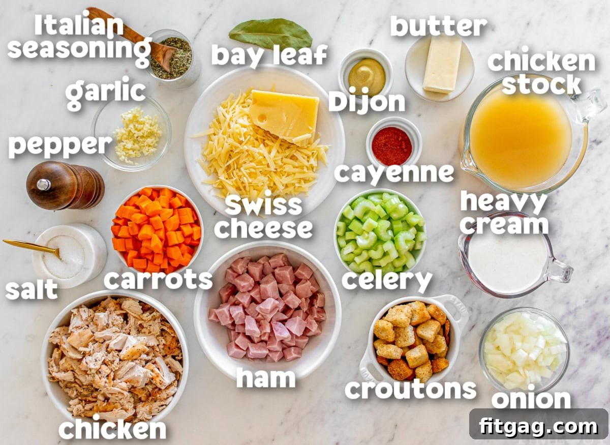 Labeled ingredients for Chicken Cordon Bleu Soup, neatly arranged in white bowls on a pristine marble surface, ready for cooking.