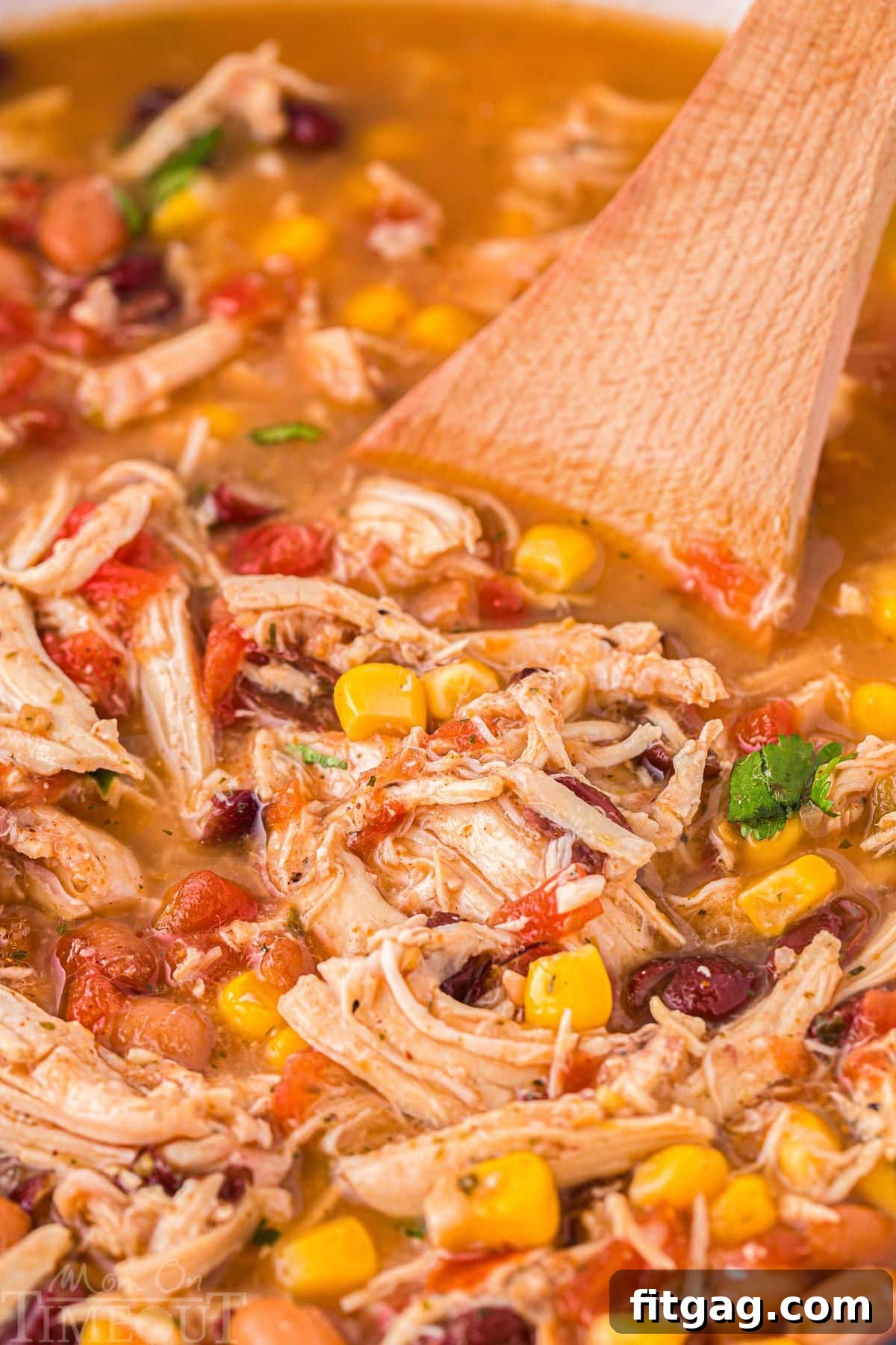 A wood spoon in the chicken taco soup.