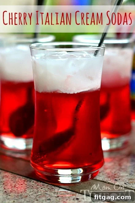 Refreshing Cherry Italian Cream Soda in a tall glass, garnished with a cherry, perfect for summer