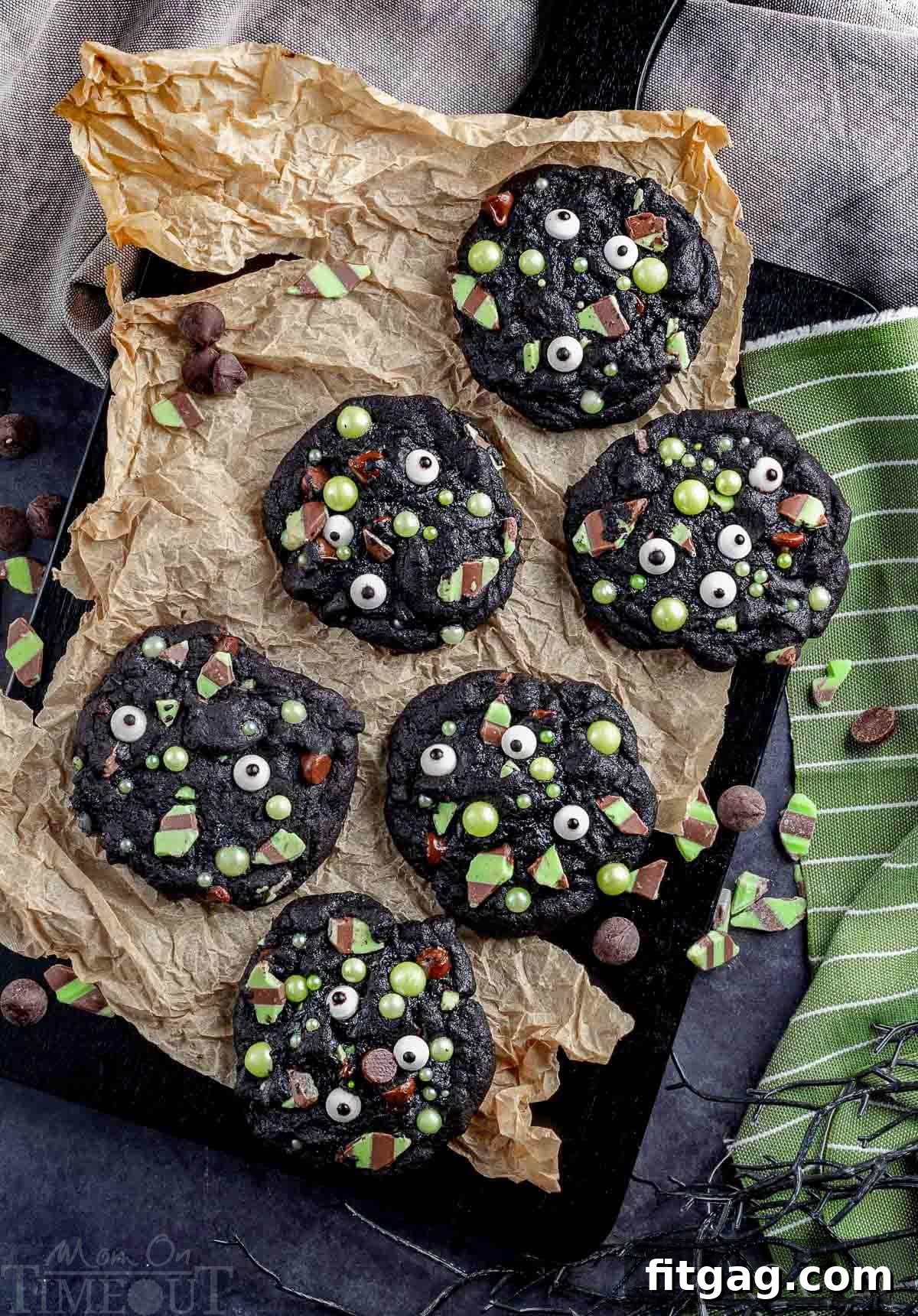 Monster Halloween Cookies laid out on a piece of brown parchment paper.