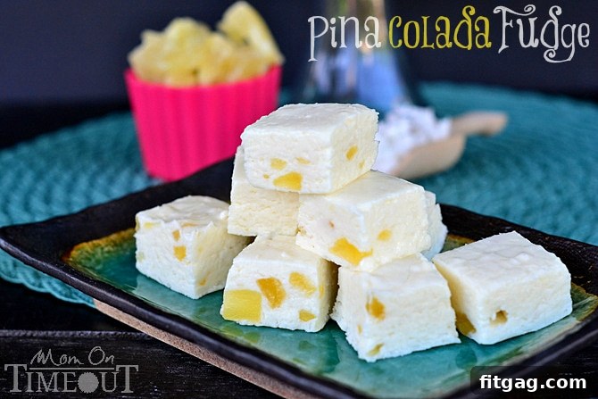 Close-up of freshly cut Pina Colada Fudge, showing the creamy texture and specks of coconut and pineapple, ready to be served.