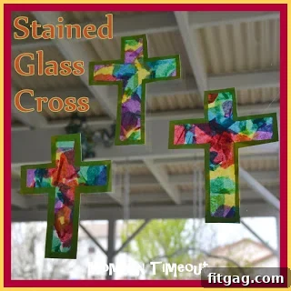 Two finished stained glass crosses displayed on a window