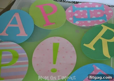 Festive Easter Egg Bunting Project 4 Using a rectangle punch to create slots on an Easter egg cutout, ready for ribbon threading.