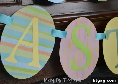 Festive Easter Egg Bunting Project 7 A two-tier 'Happy Easter' banner displayed proudly on a mantelpiece, surrounded by Easter decorations.