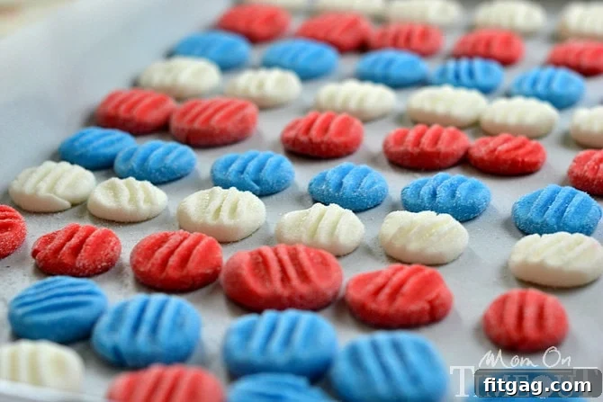 Red, White and Blue Peppermint Patties from MomOnTimeout.com - You pick the color and flavor! These patties are super easy to prepare and taste delicious! Homemade Red, White, and Blue Peppermint Patties (lemon flavored) arranged festively on a plate.