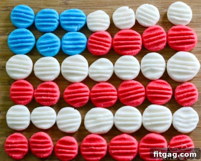 Red, White and Blue Peppermint Patties from MomOnTimeout.com - You pick the color and flavor! These patties are super easy to prepare and taste delicious! Assortment of red, white, and blue candy patties, perfect for a patriotic celebration like the 4th of July.