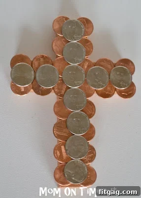 Finished Coin-Covered Cross, a beautiful and symbolic Easter craft, shining with metallic coins.