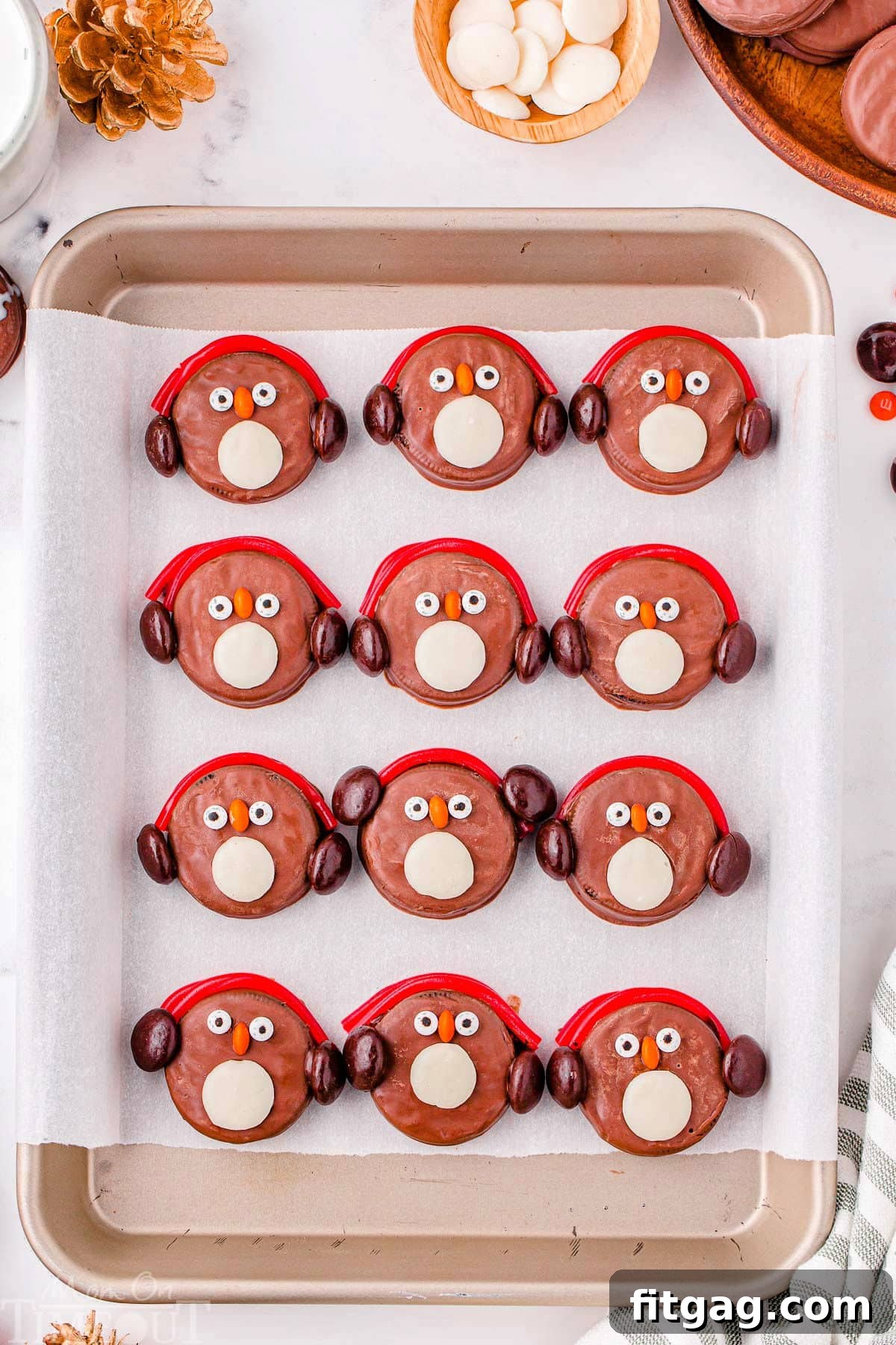Arctic Oreo Treats 4 Twelve penguin OREOs on a baking sheet lined with parchment paper.