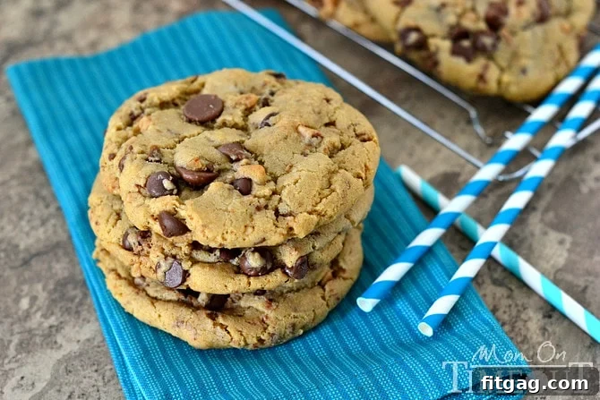 Close-up of a stack of Giant, Chewy Brown Butter Toffee Chocolate Chip Cookies showing their soft texture
