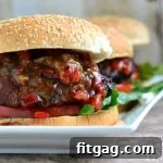 Salsa Burst Burgers 2 Juicy Salsa Burger on a white bun with fresh salsa