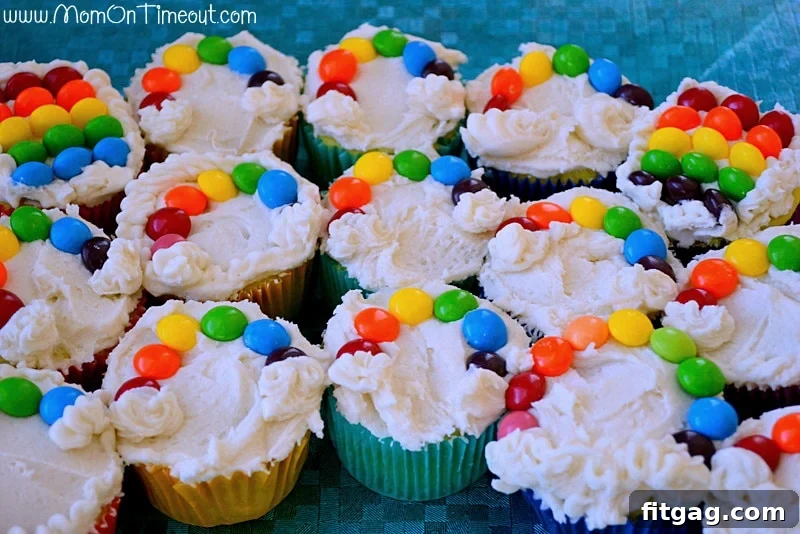 Delicious Taste the Rainbow Cupcakes decorated with colorful candy