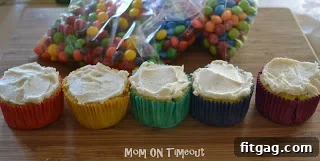 Vibrant Rainbow Bites 4 Frosted cupcakes with a smooth surface