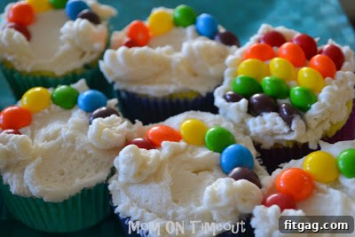 Finished rainbow cupcake with Skittles rainbow and marshmallow clouds