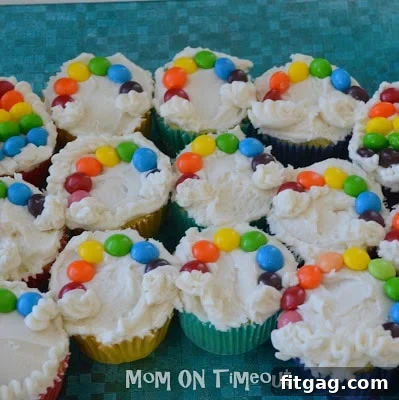 Vertical shot of a beautifully decorated rainbow cupcake