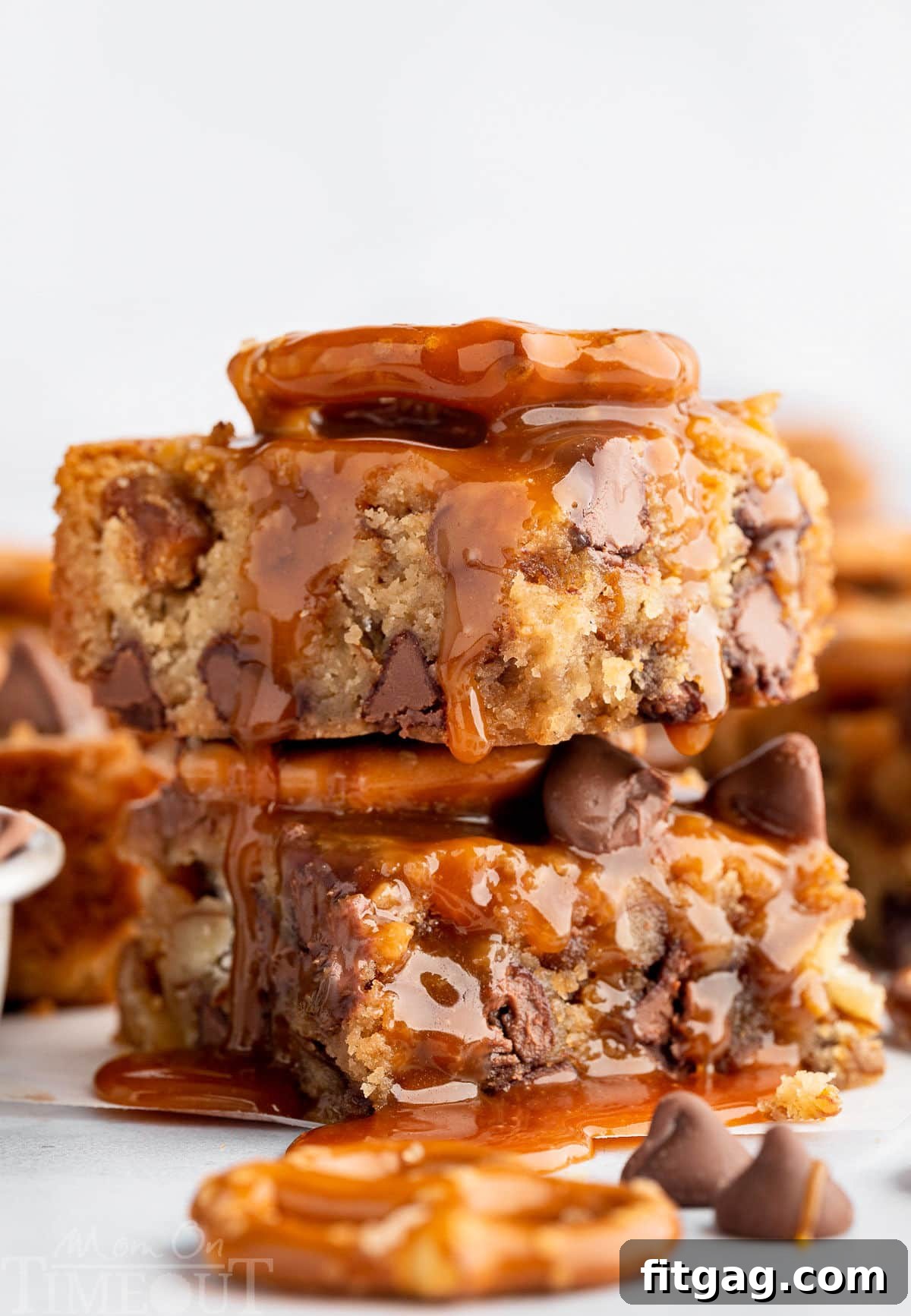 A stack of blondies with salted caramel sauce drizzled on top.