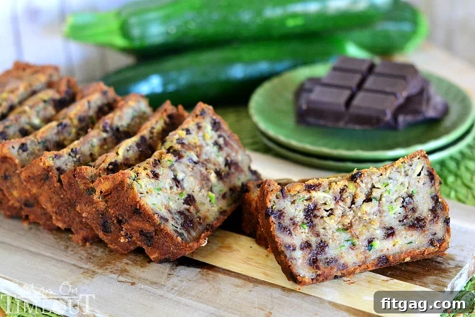 Close-up of a slice of moist Chocolate Chip Zucchini Banana Bread, revealing its tender crumb and rich chocolate pockets.