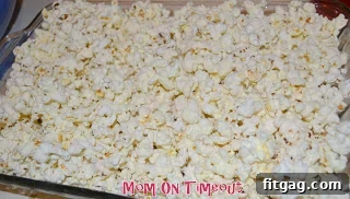 Sweet Valentine's Popcorn Balls 4 Freshly popped popcorn filling a baking dish, kept warm in the oven.