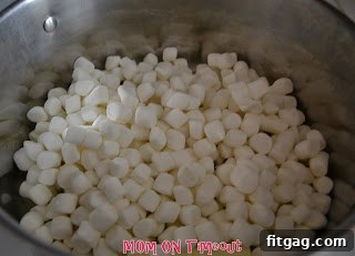 Sweet Valentine's Popcorn Balls 5 Marshmallows and butter melting together in a large pot.