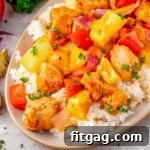Close up look at Hawaiian Chicken recipe plated with rice on an oval plate.
