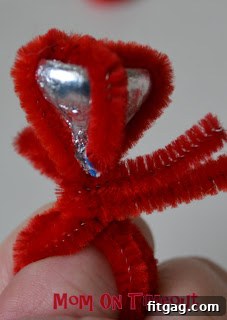 The completed Hershey's Kiss pipe cleaner ring, showcasing its sweet and shiny design.