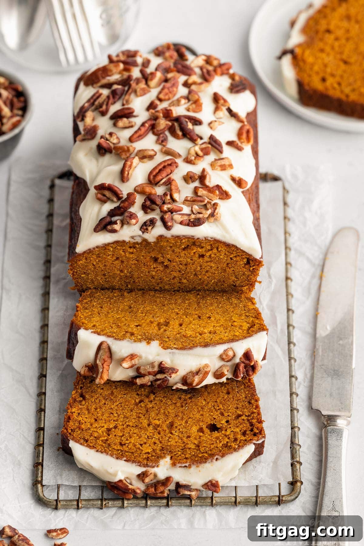 Top down look at pumpkin loaf with two slices cut.