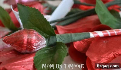 Hershey's Kiss roses with stems wrapped in decorative ribbon