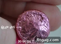 Attaching two Hershey's Kisses together with glue dots to form a rosebud