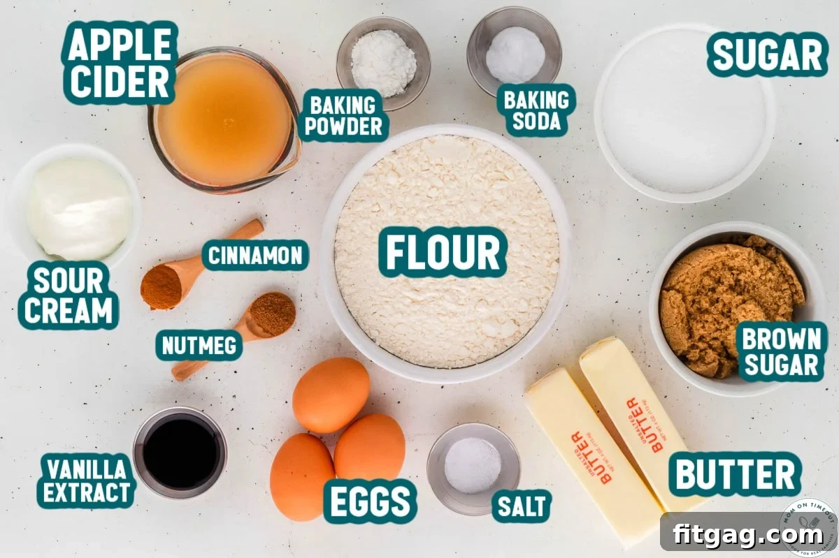 An overhead shot showcasing all the measured ingredients for the apple cider donut cake, neatly arranged in small individual bowls and clearly labeled, ready for baking. This visual guide simplifies the preparation process.